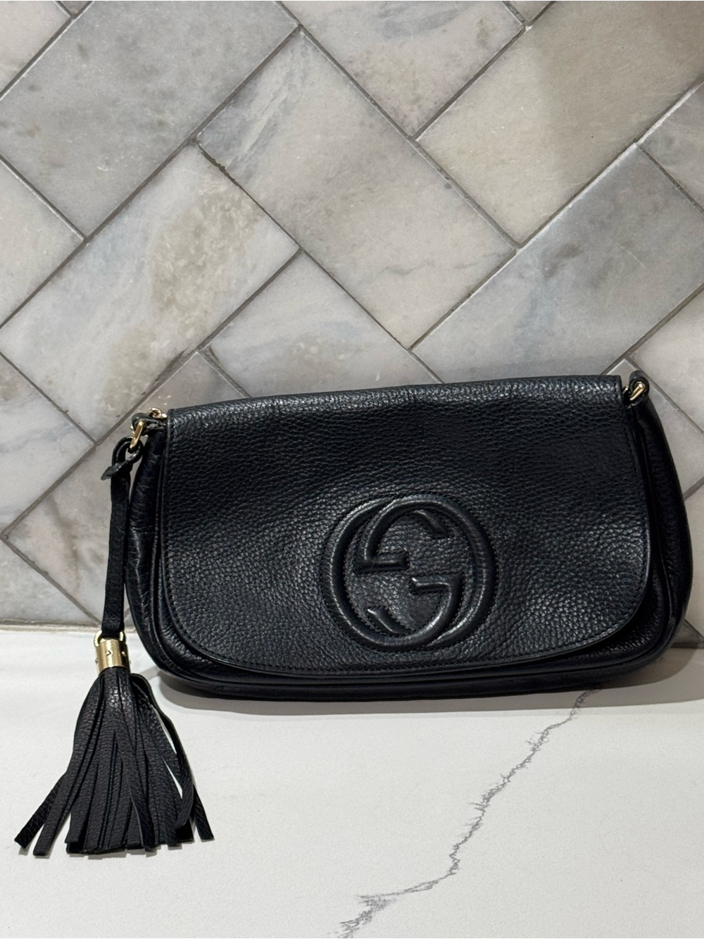 Gucci Black Pebbled Leather Tassel Clutch with Interlocking G